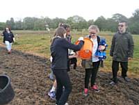 Students from Redwood Secondary School sowing Wildflower seeds in the Park. 14 students took part in the session
